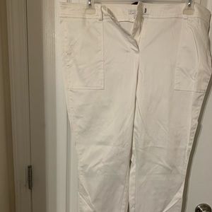 White ankle pants with gold zipper on leg